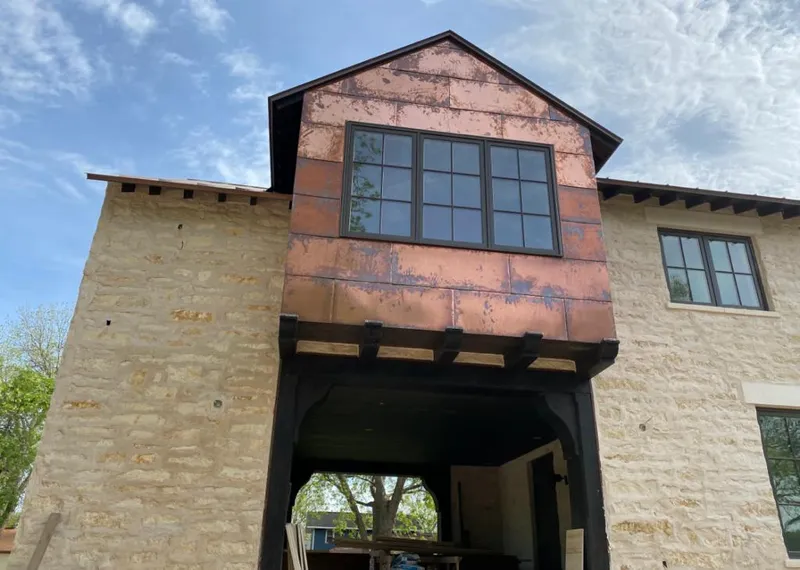 Copper metal panel facade on a stone building for Skylight Installation in Martinez