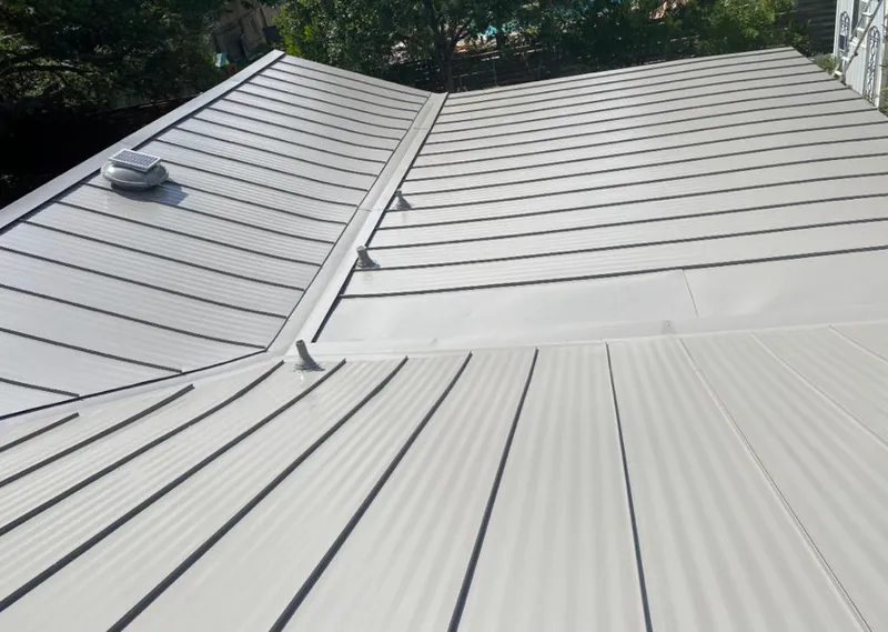 Solar attic fan installed on a metal roof for Roof Ventilation in Martinez